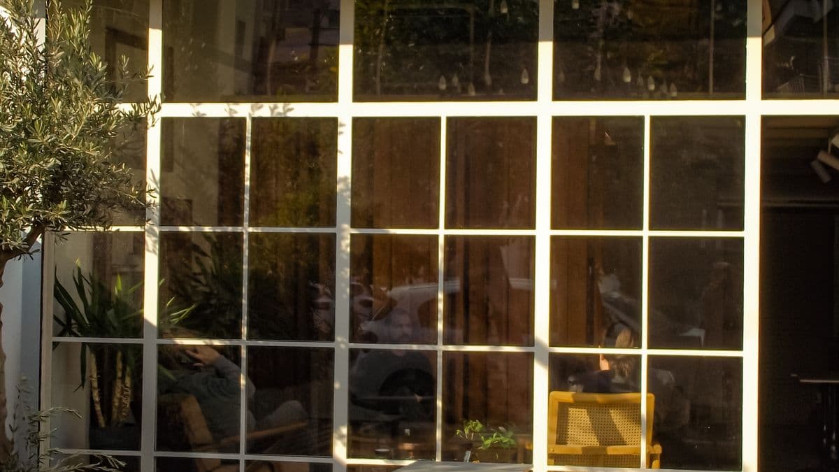 A clean retail storefront with bright, clear glass windows.